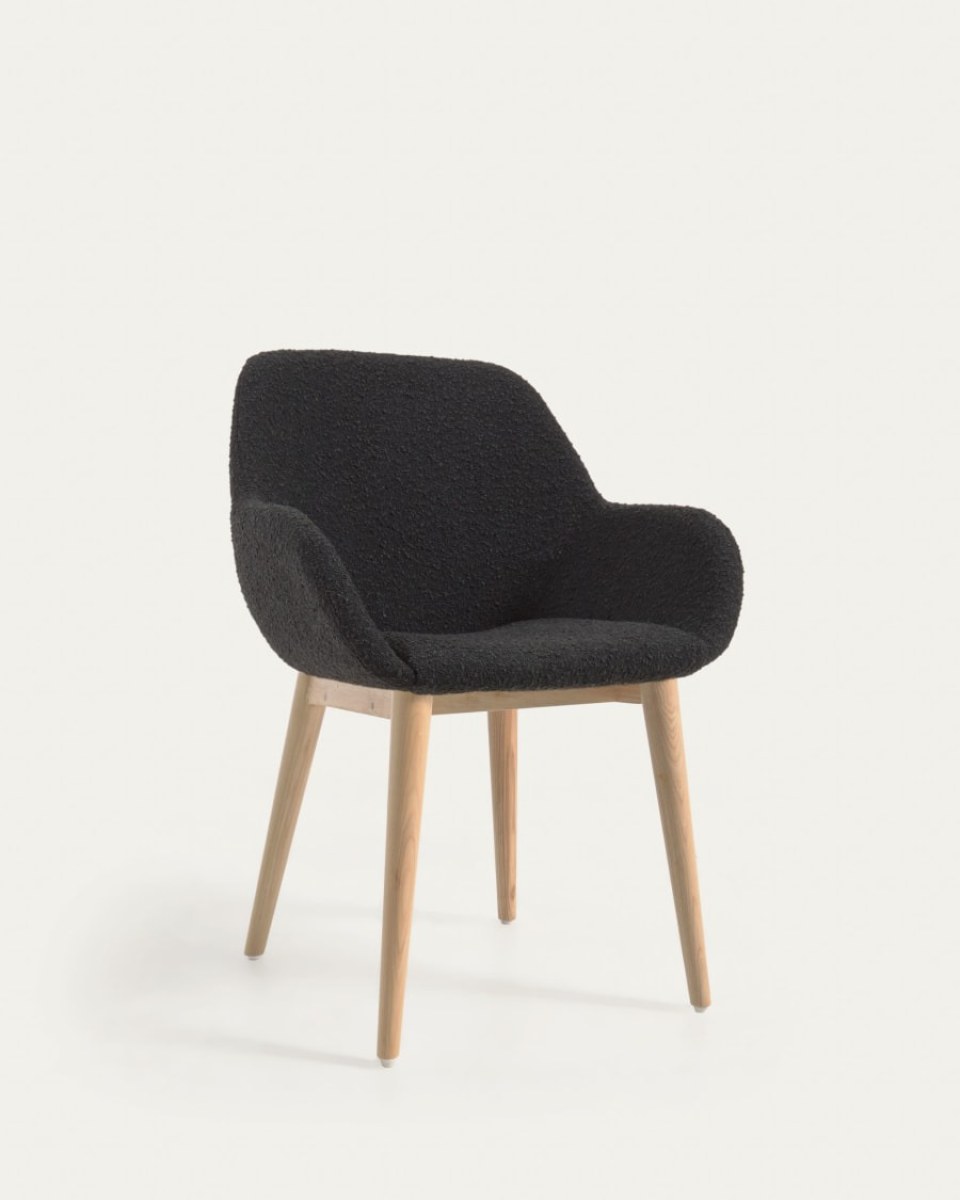 Konna chair in black fleece with solid ash wood legs in a natural finish