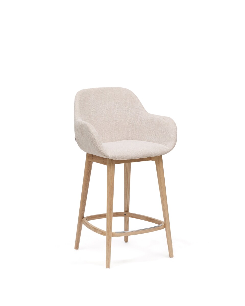 Konna stool in beige and solid ash wood legs in a light finish. 65 cm